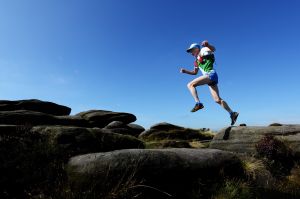 Tony Whithouse running above Stanage - Peak District